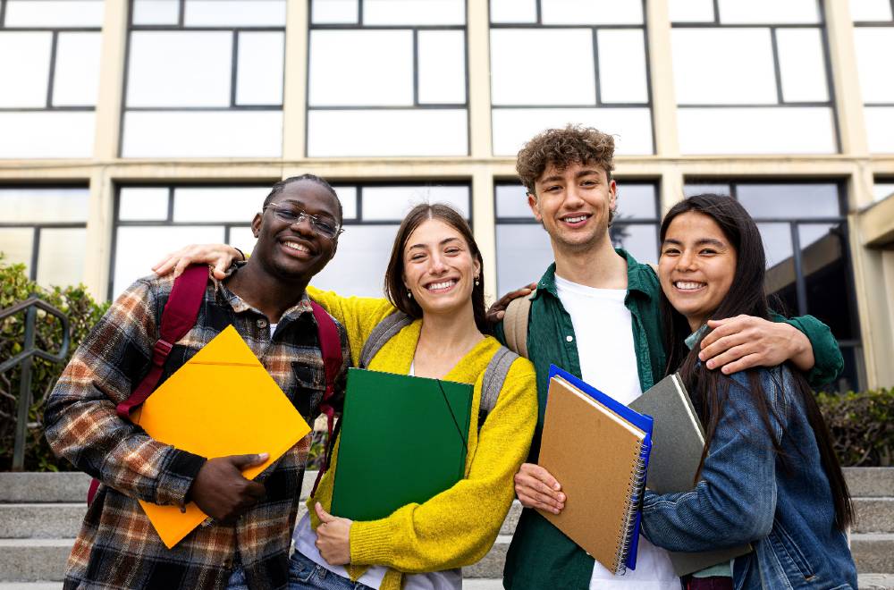 Students standing in front of the university, showcasing the impact of Digital Marketing for Educational Institutions in attracting prospective students.